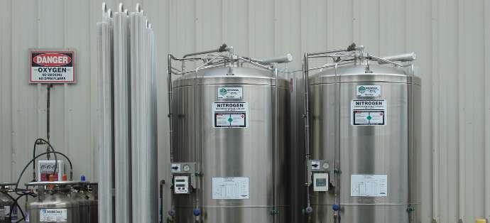 On-site microbulk delivery system at customer location, oxygen and nitrogen tanks installed and monitored by Industrial Source