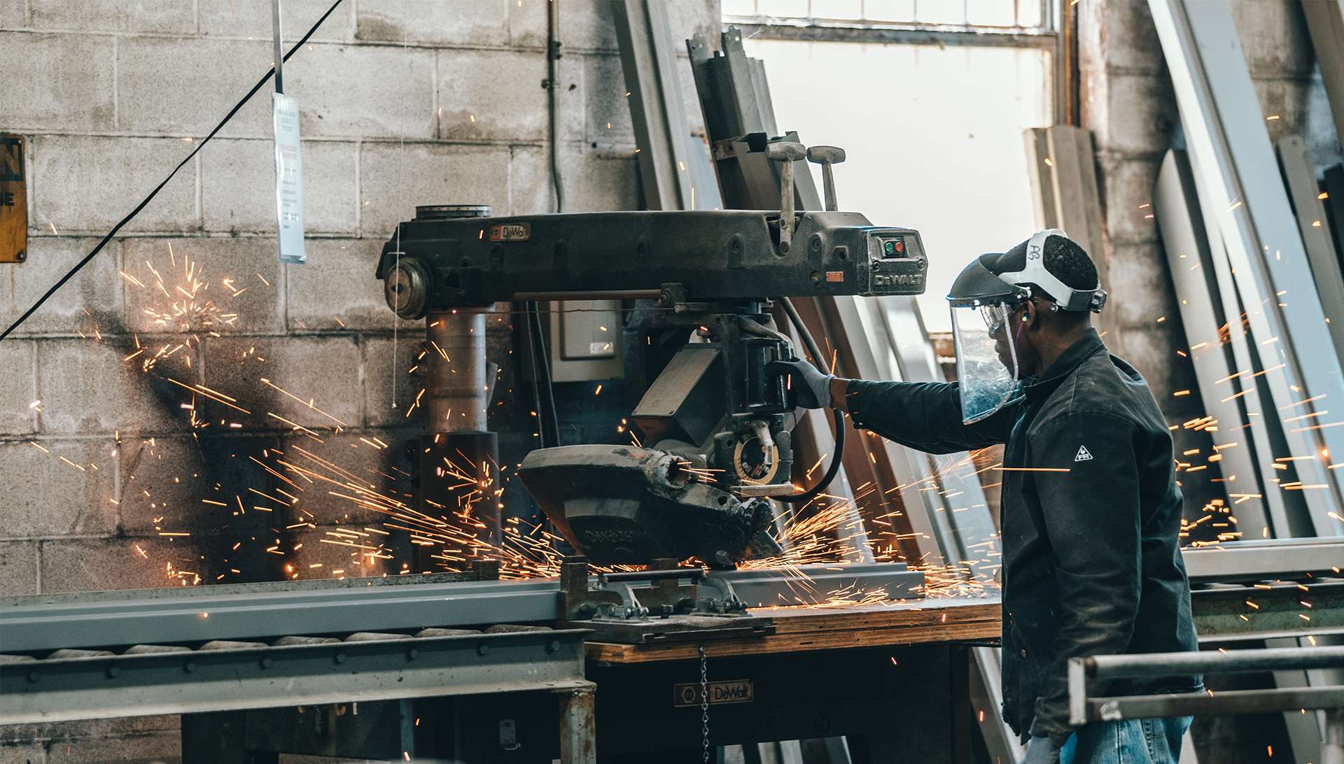 Industrial Source welder mid-cut, full PPE on site